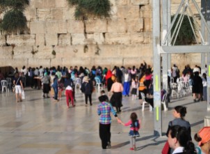 women's side of the Western Wall (what you can't tell is that they're walking backwards away from the wall)